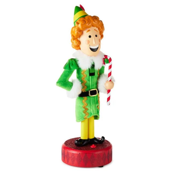 Christmas elf figurine nutcracker holding a candy cane on a white background