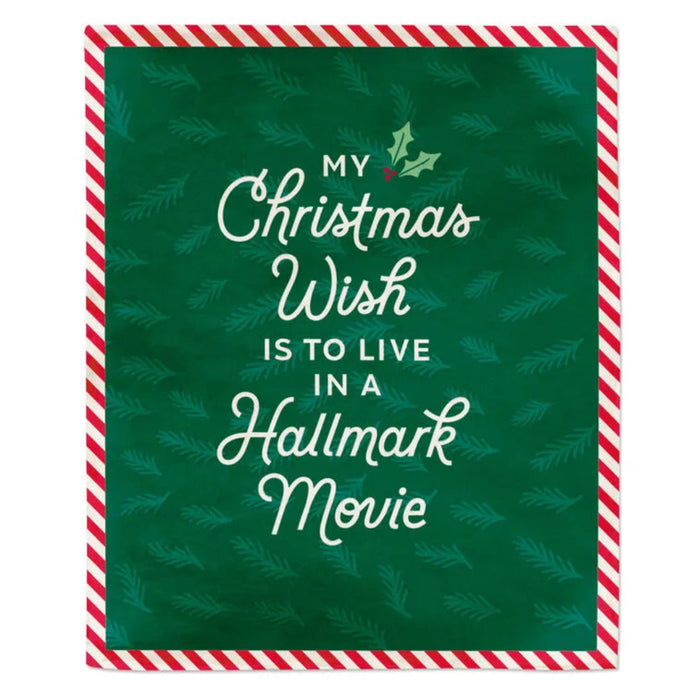 Christmas-themed Hallmark Channel Blanket with text 'My Christmas Wish is to live in a Hallmark movie' on a green background with red and white striped border.