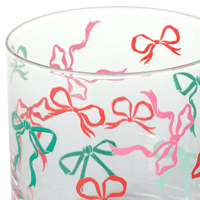 Clear glass with colorful bow pattern on a white background