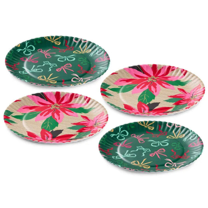 Set of four decorative paper plates with floral and bow patterns on a white background