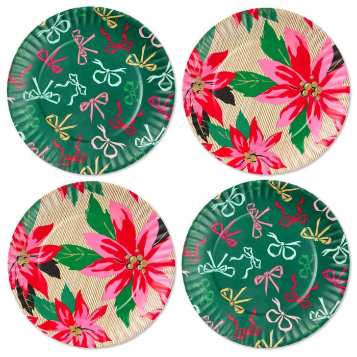 Set of four festive paper plates with floral and bow designs on a white background
