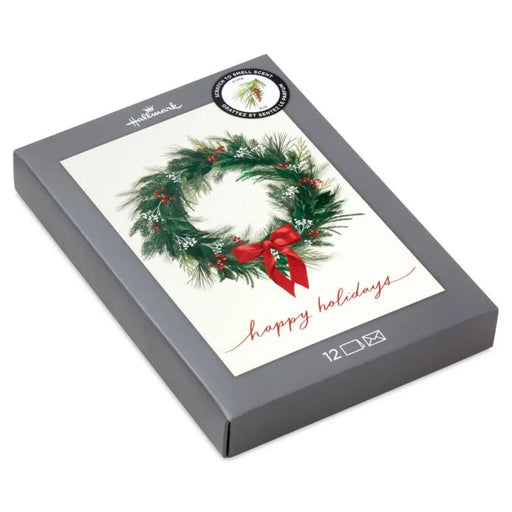 Gray box with a Christmas wreath and 'happy holidays' text on a white background
