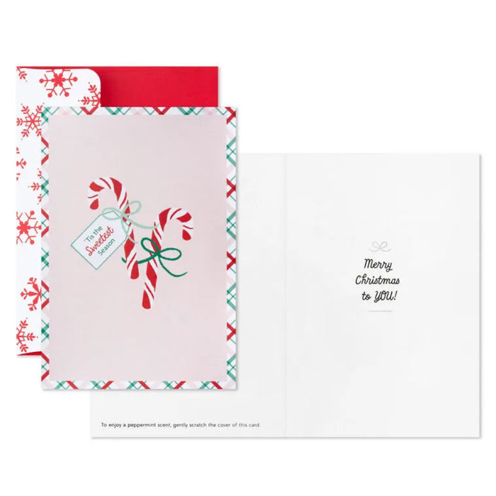 Christmas-themed card with candy canes and snowflakes on a white background