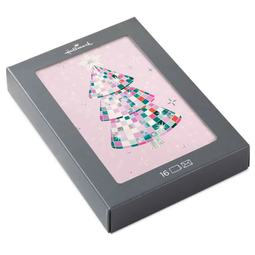 Hallmark Christmas card with a colorful tree design on a pink background, housed in a gray box.