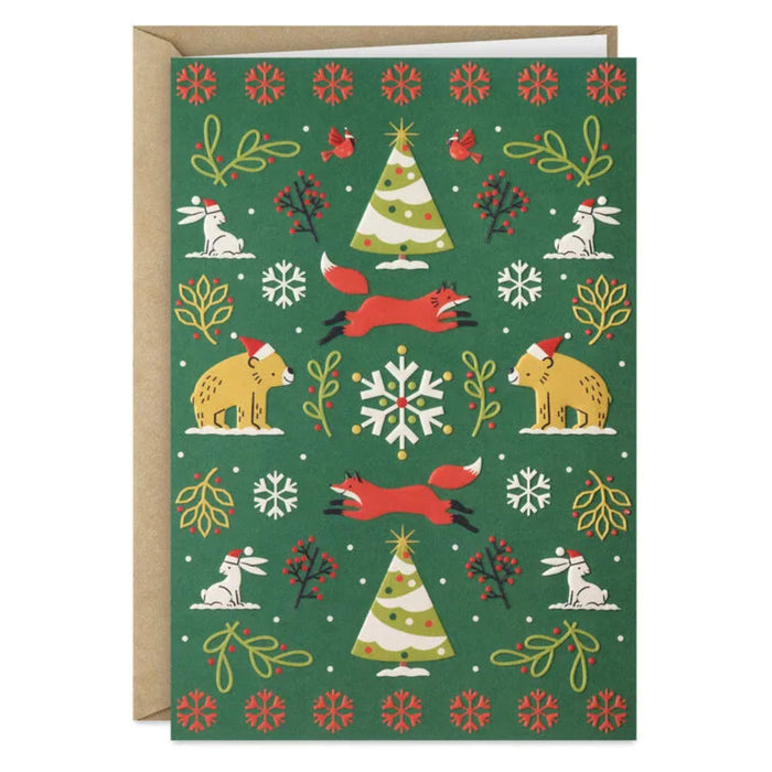 Christmas-themed greeting card with animals and trees on a green background