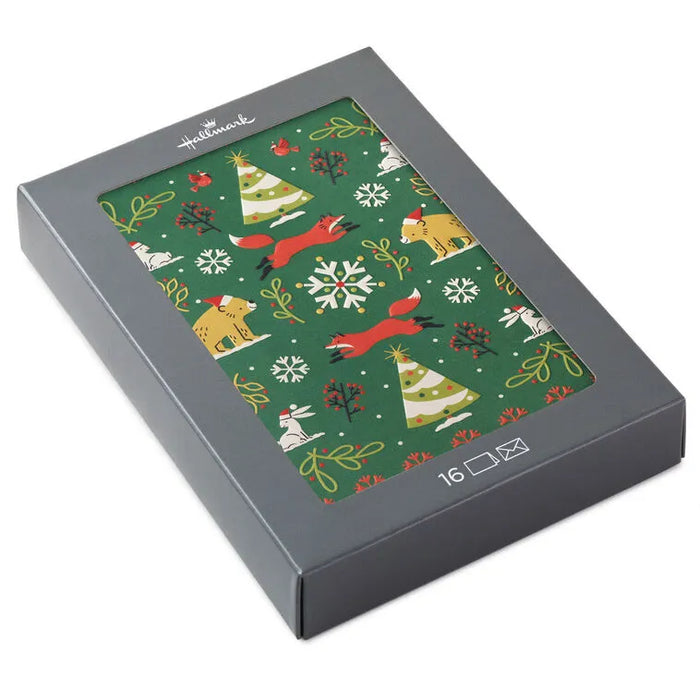 Holiday-themed box with festive design featuring animals and trees on a green background.