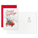 Christmas card with red car and tree in snow, red envelope, and white card with text.