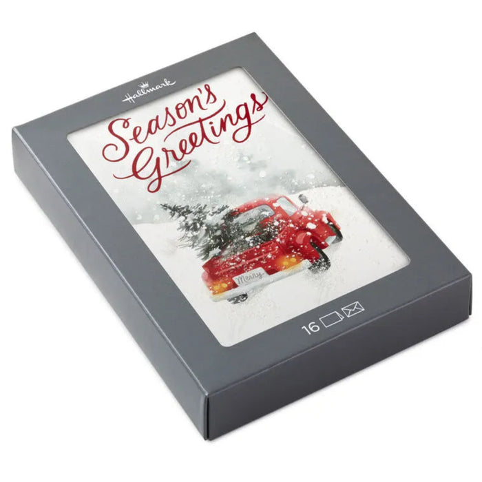 Hallmark Seasons Greetings card with a red car in a snowy scene, displayed in a gray box.