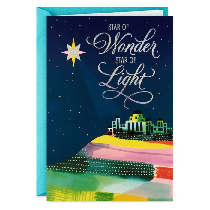 Greeting card with 'Star of Wonder, Star of Light' text and festive design.