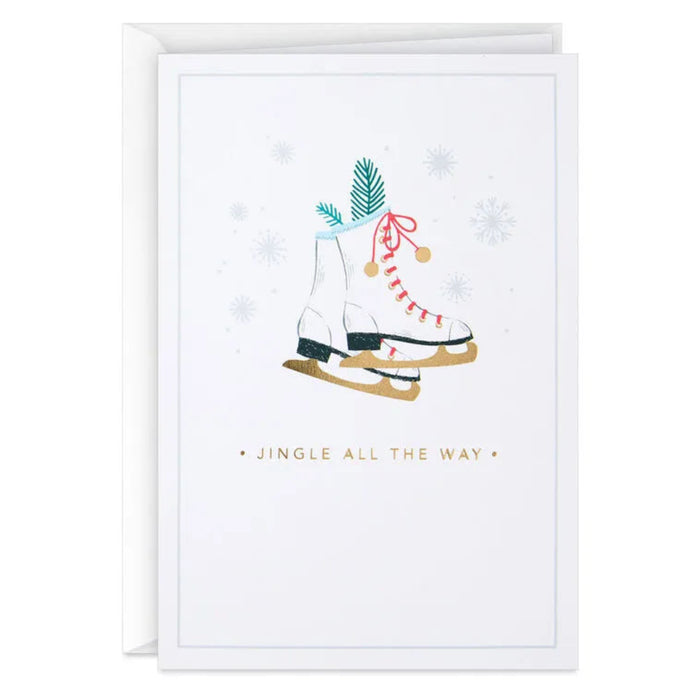 Holiday card with ice skates and jingle bells on a white background
