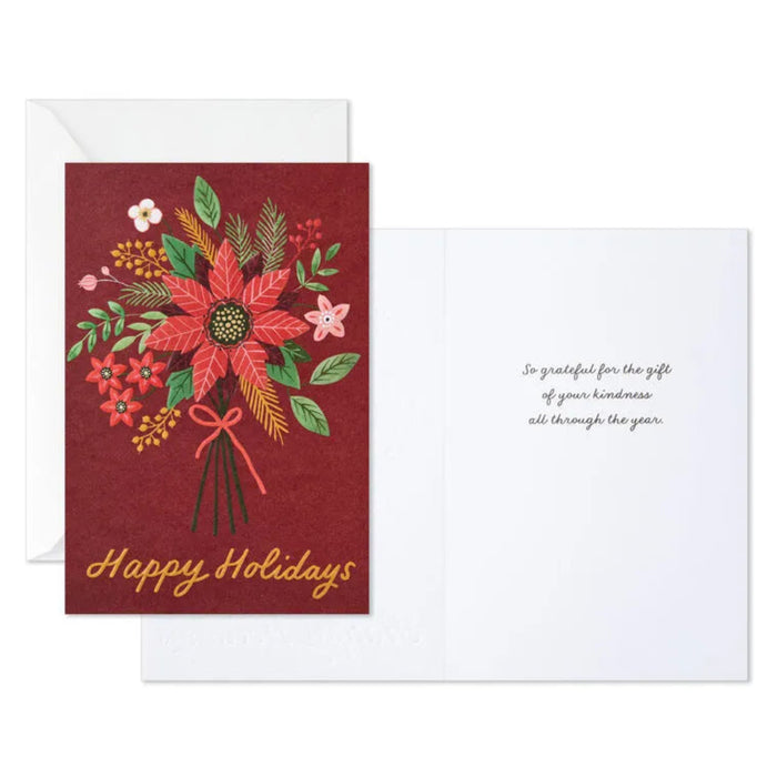 Greeting card with floral design and 'Happy Holidays' text on a red background