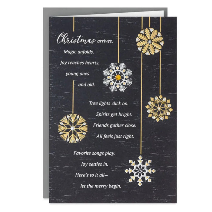 Christmas card with snowflake designs and text on a dark background