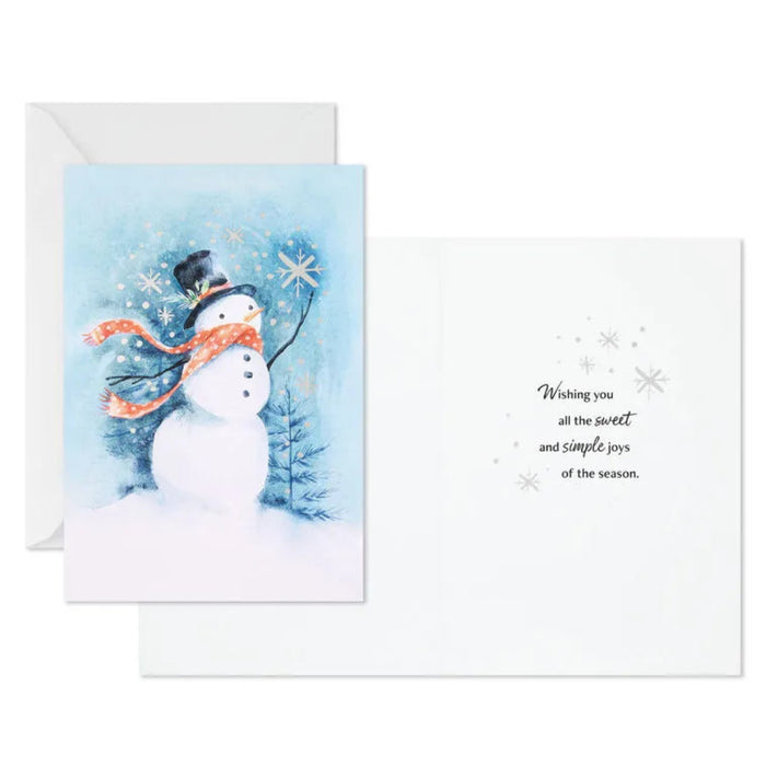 Greeting card with a snowman design and winter scenery on a white background