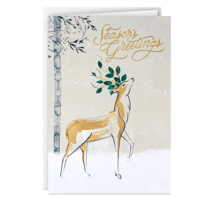 Greeting card with a deer illustration and 'Season's Greetings' text on a snowy background.