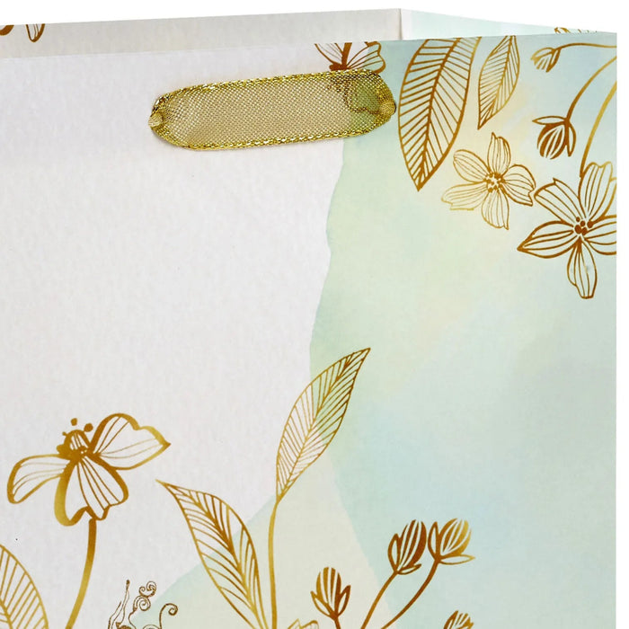 Hallmark 9.6-inch Gold Wildflowers Medium Gift Bag featuring an elegant gold wildflower design and stylish gift packaging for special occasions.