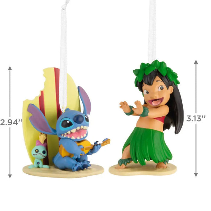 Two Disney Lilo and Stitch ornaments,  one blue character and one in a green hula outfit with measurements on a white background
