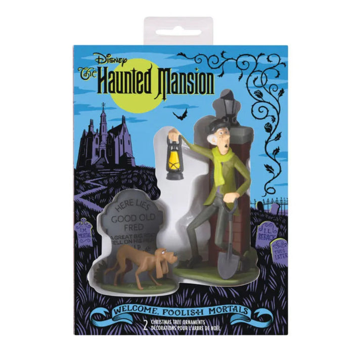 Disney Haunted Mansion Christmas ornaments set with caretaker and dog in themed storage box on a white background.