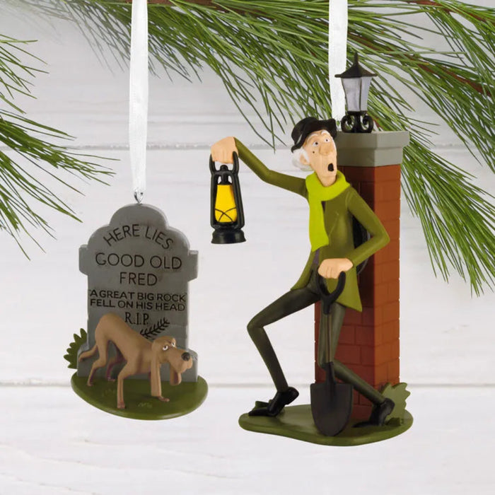 Disney Haunted Mansion Christmas ornaments set with caretaker and dog in themed storage box.”