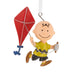 Ornament of Charlie Brown character with a red kite on a white background