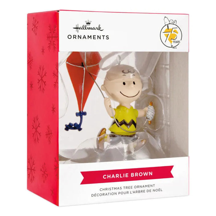 Hallmark Charlie Brown Christmas ornament packaging with red and white design.