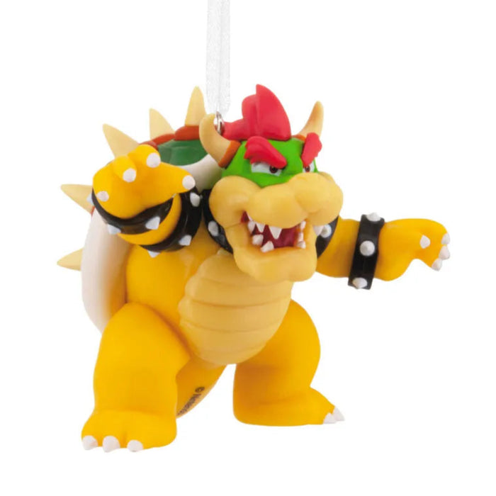Toy figure of Bowser from Mario games on a white background
