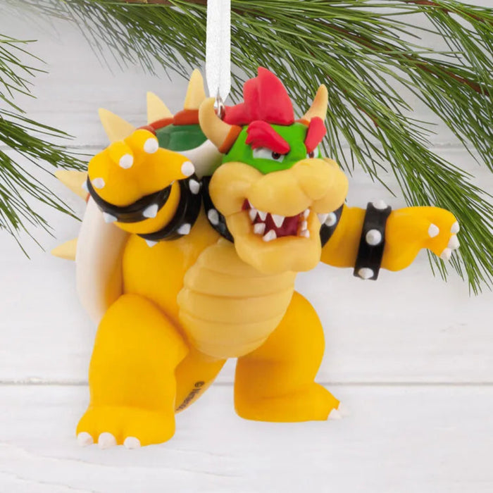 Bowser figurine ornament with green pine in the background