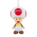 Character figurine with red and white cap on a white background