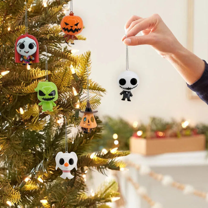 Halloween-themed Christmas tree ornaments on a decorated tree with a hand reaching out.
Assorted no choice, one mystery box included 