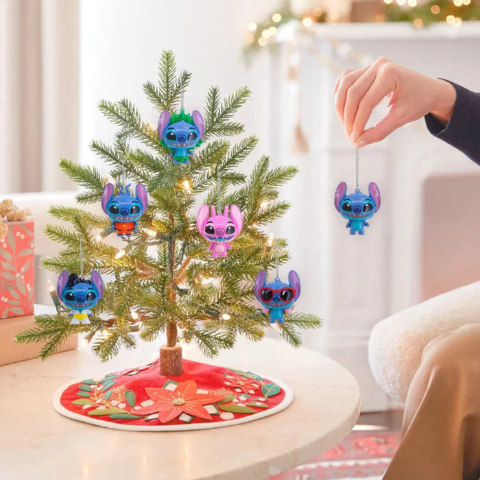 Small Christmas tree with animated  Stitch character ornaments in a living room setting