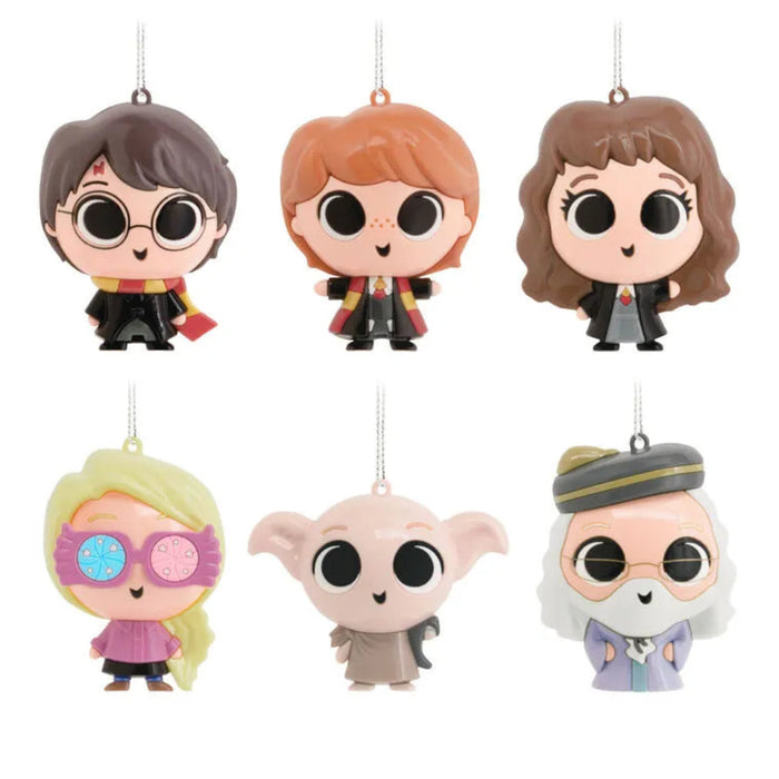 Includes one of the Set of six  Harry Potter-themed figurine ornaments  on a white background. Assorted, one chosen at  random. 