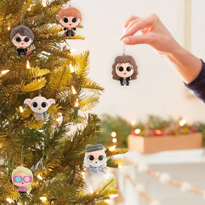 One of six chosen at random Harry Potter mystery ornaments on a Christmas tree with a blurred indoor background