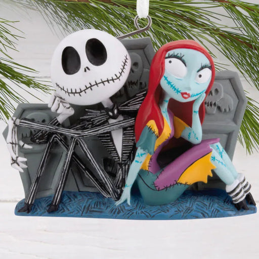Ornament featuring Jack Skellington and Sally from 'The Nightmare Before Christmas' on a white background.
