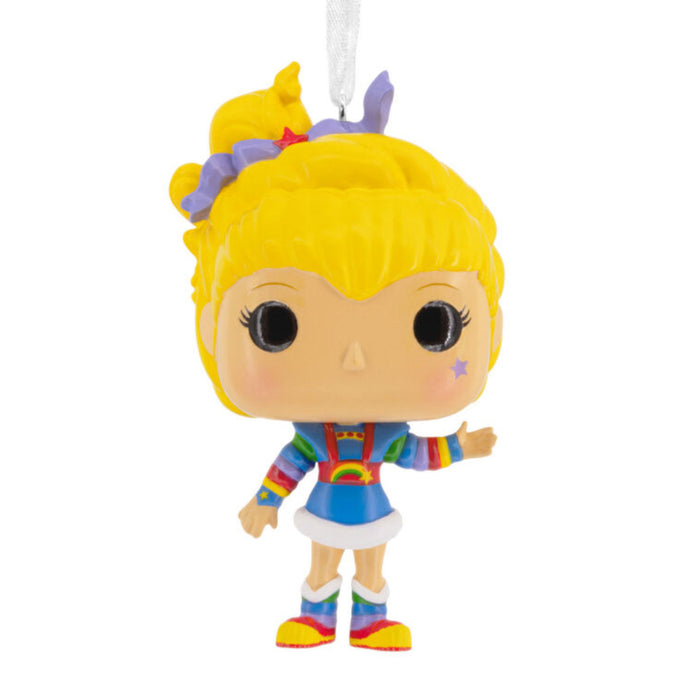 Colorful figurine with blonde hair and rainbow outfit on a white background