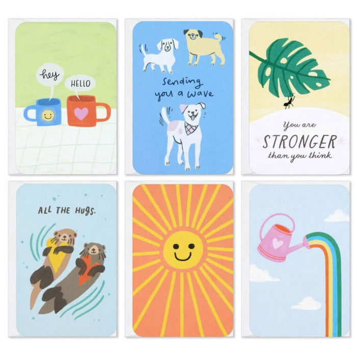 Set of six  Hallmark colorful greeting cards with various illustrations and text on a white background