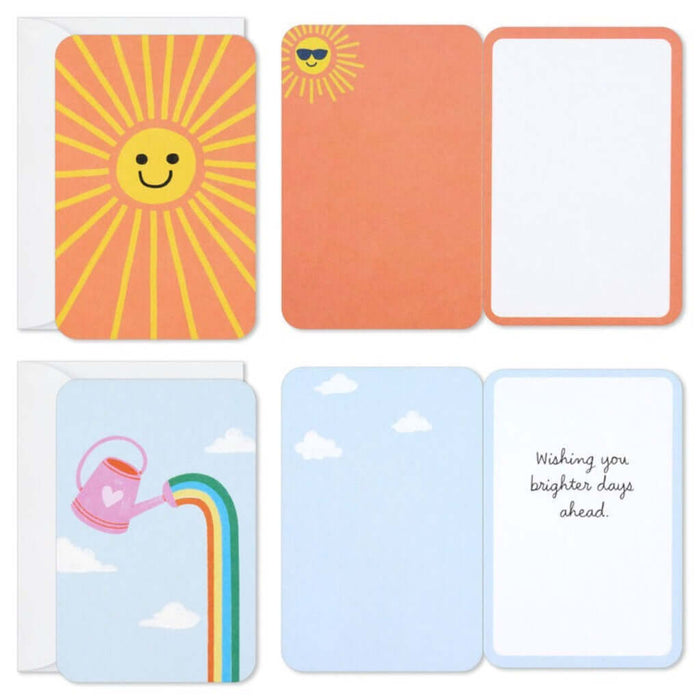 Set of four colorful greeting cards with sun, rainbow, and cloud designs on a white background. 