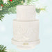 White textured cake ornament with '2026' on a light blue background