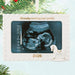 Christmas ornament with ultrasound image and '2026' on a white background