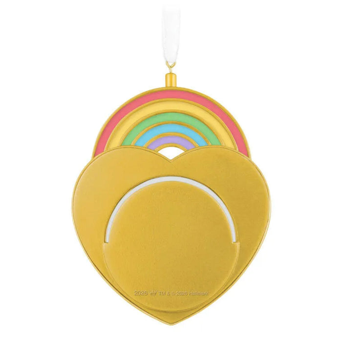 Decorative heart-shaped ornament with rainbow design on a white background