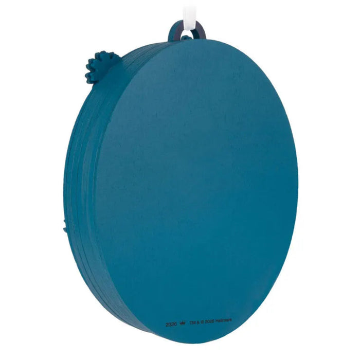 Blue circular object with a handle on a white background
