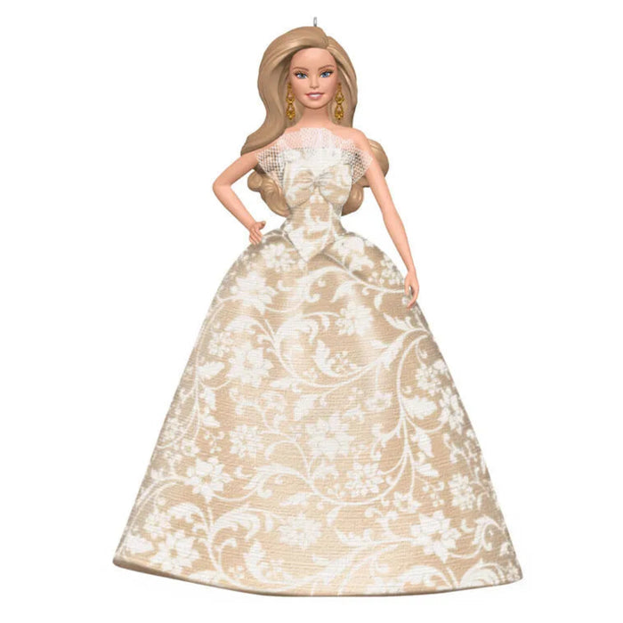 Barbie doll wearing a white lace dress on a white background