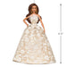Latina Barbie doll in a white lace dress with dimensions indicated on a white background