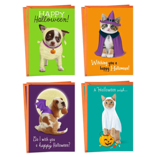 Four Halloween-themed greeting cards with dogs and cats in costumes on a white background.