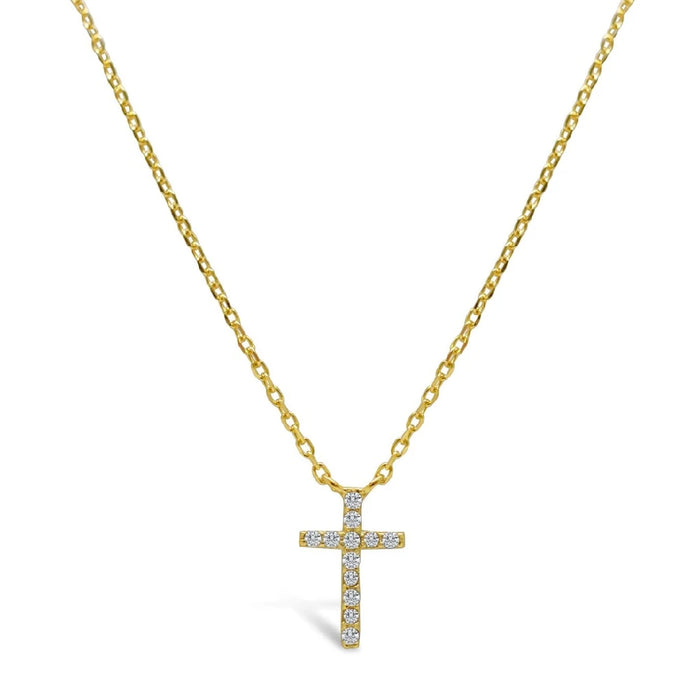 A gold cross necklace adorned with sparkling diamonds, showcasing elegance and luxury.