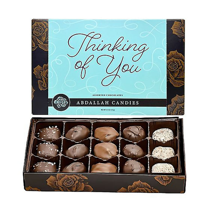 Box of chocolates with 'Thinking of You' message and Abdallah Candies branding.