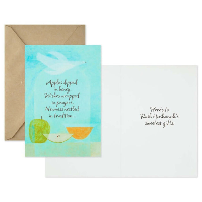 Greeting card with apples, honey, and dove illustration on a light blue background, accompanied by a brown envelope.