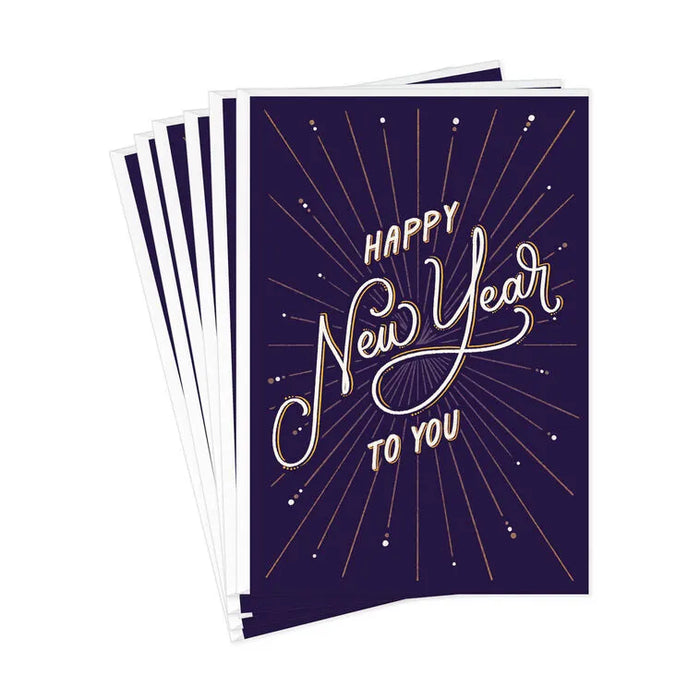 Stack of greeting cards with 'Happy New Year to You' text on a purple background