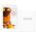Thanksgiving card with pumpkins, flowers, and a white envelope.