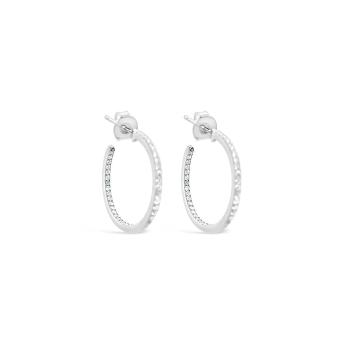 CZ stones line the inside and outside of the hoop, making you sparkle and shine at all times.
