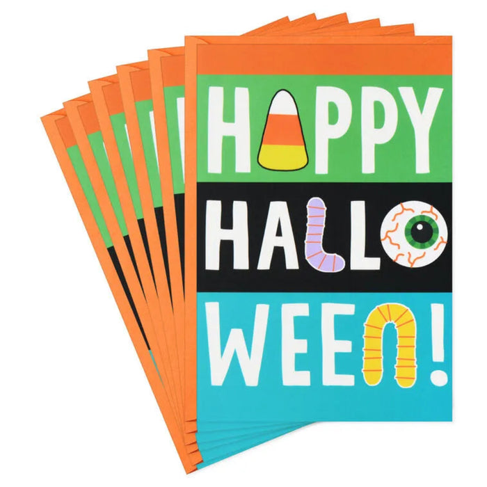 Stack of Halloween-themed greeting cards with colorful design and text.