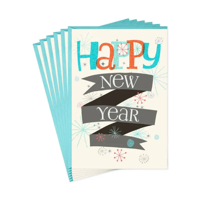 Stack of greeting cards with 'Happy New Year' text on a white background